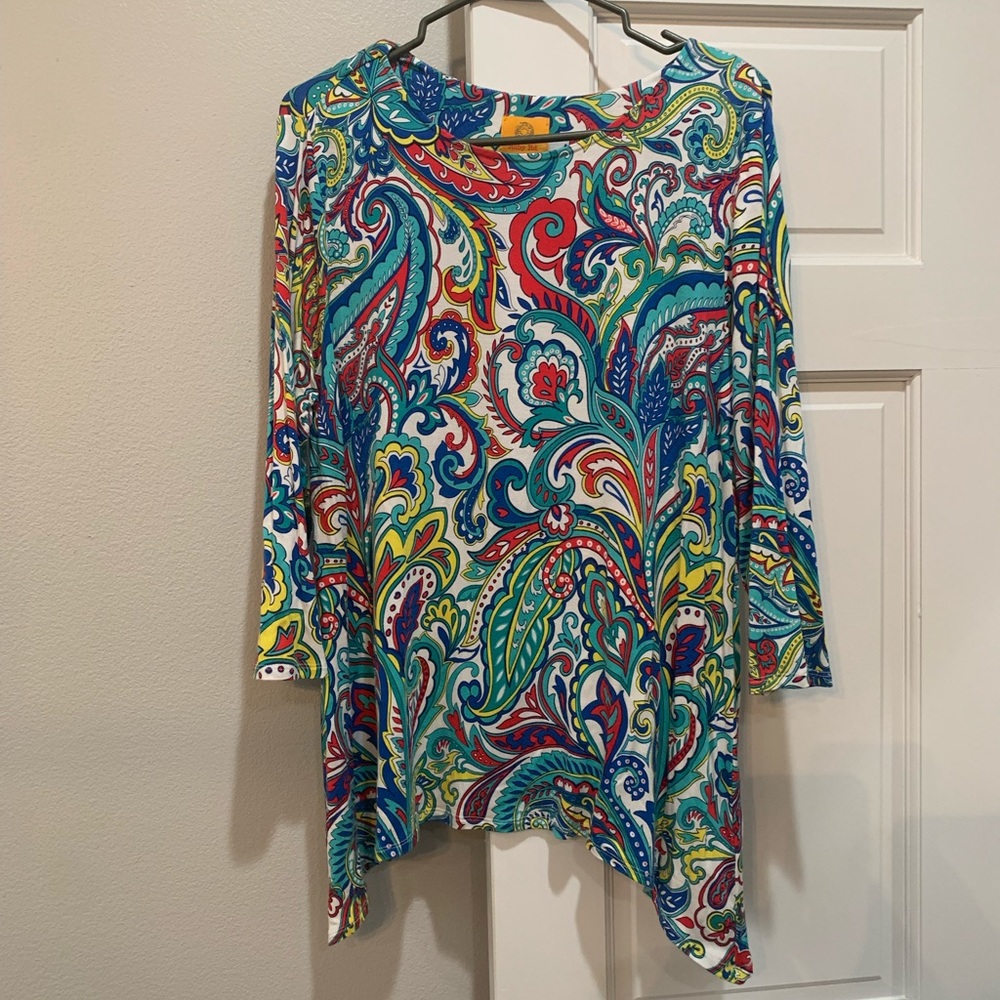 Woman’s top shark bite hem tunic